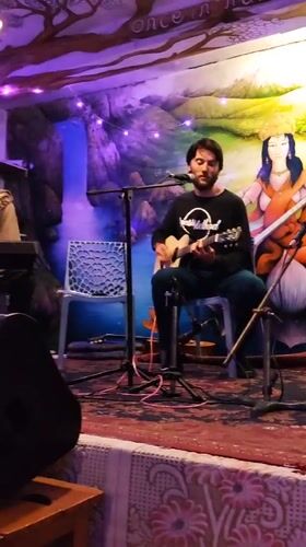 Musicians perform at cafe in Haini, India