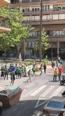 Green-shirted demonstrators gather in Alicante streets during morning protest
