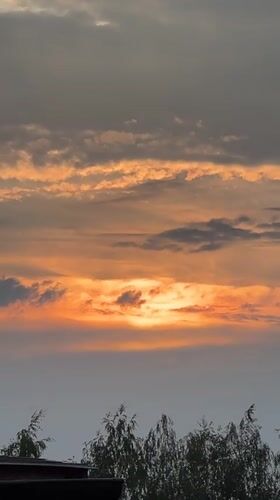 Golden hour fades to twilight over rural Dys, Poland