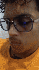Orange-shirted individuals recorded indoors at Venezuelan beach location