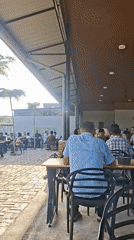 Cafe hangout and gas station queue in rural Keudebayu