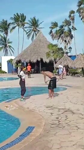 Resort guests enjoy poolside hula hoop activities in Venezuela