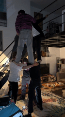 Young adults form human pyramid in Tel Aviv loft