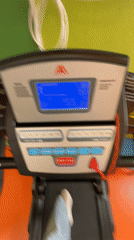 Woman exercises on treadmill at Izhevsk gym early morning