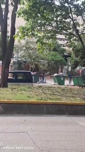Child plays with orange kitten in Caracas neighborhood