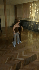 Swing dancers perform in herringbone-floored room in Saint Petersburg