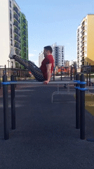 Man exercises on playground equipment in Pervomaysky, Russia