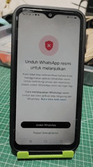 Unofficial WhatsApp flagged on a phone in Sragen