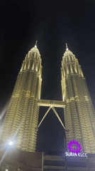 Witness documents illuminated Petronas Towers at night in Kuala Lumpur
