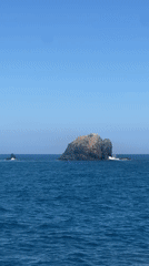 Boat passenger films rocky islands off Karangasem coast