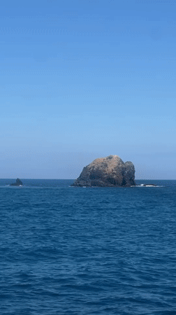 Boat passenger films rocky islands off Karangasem coast