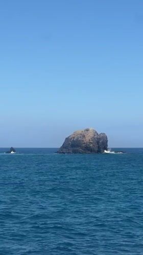Boat passenger films rocky islands off Karangasem coast