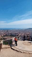 Tourist captures Barcelona panoramas and street scenes during midday walk