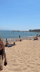 Sunny beach day captured in Barcelona with typical recreation