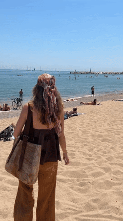 Sunny beach day captured in Barcelona with typical recreation