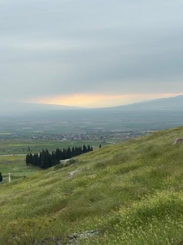 Hillside views captured overlooking Pamukkale town and white terraces