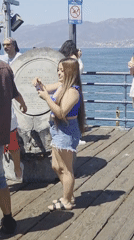 Busy afternoon on Santa Monica Pier, Ferris wheel in view