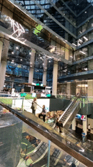 Witnesses document modern shopping mall interior during afternoon hours