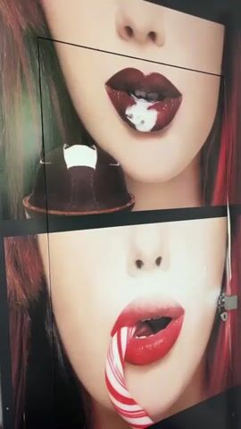 The video shows a panel of four different close-up photos of a woman's mouth. All the photos feature a woman with fair skin and reddish hair. In each photo, the woman's mouth is open and eating different foods. In the top right photo, the woman has dark red lipstick and is eating a chocolate dome with white frosting. In the bottom right photo, the woman has red lipstick and is eating a candy cane. In the top left photo, the woman has red lipstick and is eating a green grape. In the bottom left photo, the woman has nude-colored lipstick and is eating a chocolate popsicle. The photos are arranged in a square formation and are likely part of an advertisement or art installation.