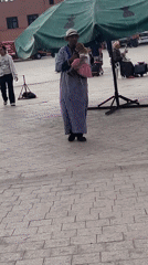 Street performer with costumed monkey draws crowds in Marrakesh