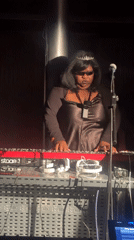 Woman performs on red synthesizer at London venue