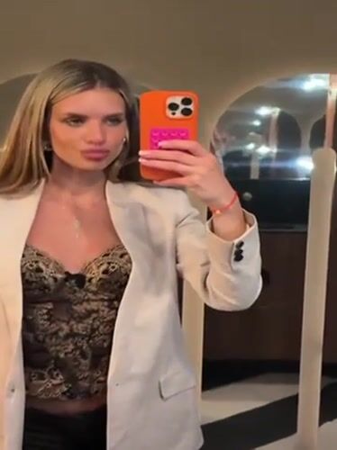 Woman takes bathroom mirror selfies in Berlin