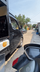 Scooter ride through a quiet Batam residential neighborhood