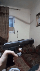 Domestic scenes and weapon display documented in Khan Yunis