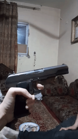 Domestic scenes and weapon display documented in Khan Yunis