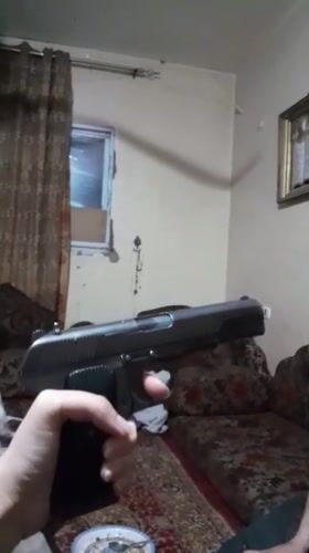 Domestic scenes and weapon display documented in Khan Yunis