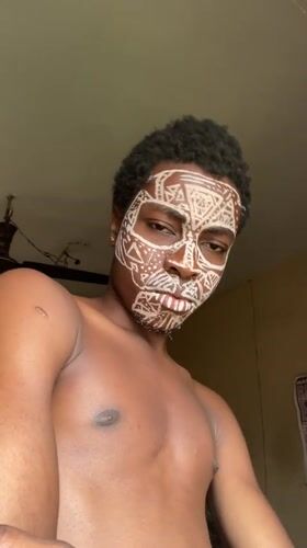 Young man displays traditional tribal face paint in Nkpor