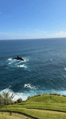 Tourists capture scenic coastal views at São Vicente, Portugal