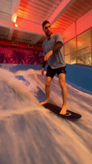 Bodyboarding a machine-made wave at a Khabarovsk indoor park