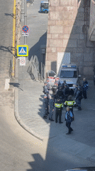 Police gather near solar buses in Moscow's Red Square