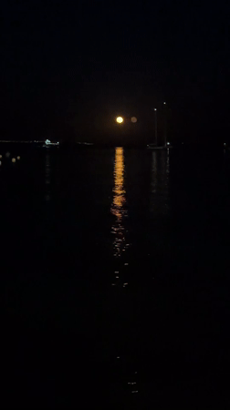Full moon over a calm Mallorcan coast on a summer night