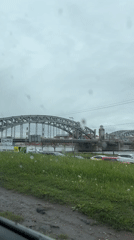 Metal arched bridge observed in Saint Petersburg during cloudy conditions