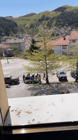 Military personnel load ATVs in Zlatograd Bulgaria schoolyard