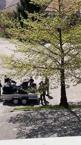 Military personnel load ATVs in Zlatograd Bulgaria schoolyard