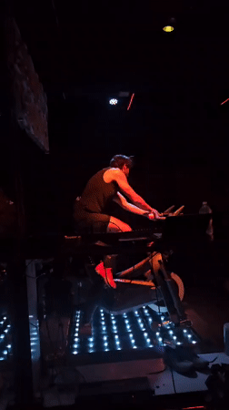 Person exercises on stationary bike in Puebla room