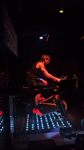 Person exercises on stationary bike in Puebla room