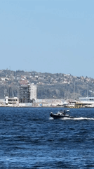 Cargo ship and motorboats observed in Varna harbor waters
