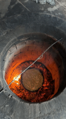 Traditional tandoor oven in operation in Arshaluys, Armenia