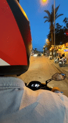 Evening motorcycle ride documented through streets of Fethiye, Turkey