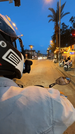 Evening motorcycle ride documented through streets of Fethiye, Turkey