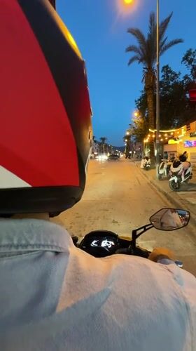 Evening motorcycle ride documented through streets of Fethiye, Turkey