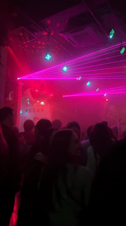 Moscow nightclub draws crowds under colorful laser light display