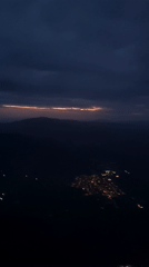 Dawn flight over Stuttgart captures city lights to sunrise transition