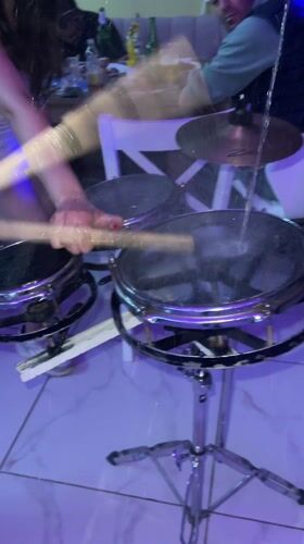 Drummer performs with fire element in Bulgarian restaurant