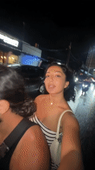 Woman films nighttime scooter ride through North Kuta streets