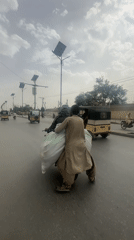 Daily life moments captured in Quetta: motorcycle riders, seated woman